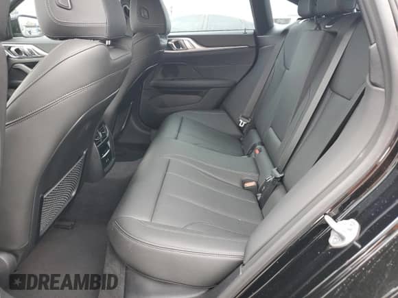 2024 BMW i4 eDrive35 with VIN WBY43AW05RFS57427, listed as a Copart auction lot 65464855 with 7,096 mi miles and Salvage title. Bid and sale history available at DreamBid. Image 10.