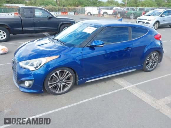 2016 Hyundai Veloster Turbo с VIN KMHTC6AE6GU295721, выставлен на аукционе IAAI как лот 43409419 с пробегом 103 962 миль миль и . История ставок и продаж доступна на DreamBid. Изображение 2.