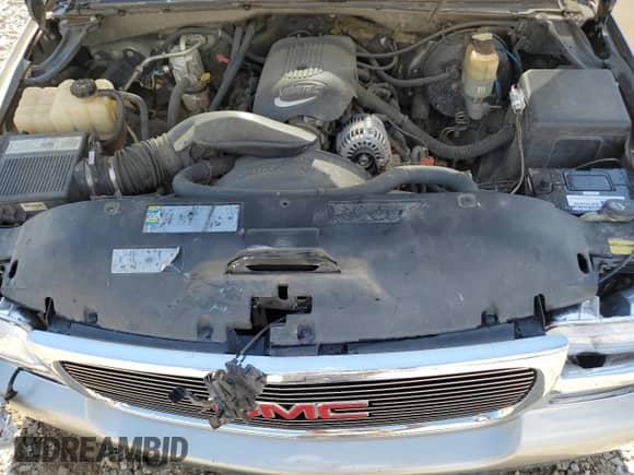 2002 GMC Sierra 1500 SLE with VIN 2GTEK19TX21244121, listed as a Copart auction lot 63050985 with 217,090 mi miles and Salvage title. Bid and sale history available at DreamBid. Image 11.