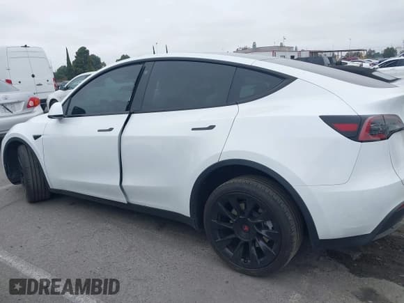✅ 2023 Tesla Model Y Long Range • VIN: 7SAYGDEE3PA055497 • Lot: 42396529. Listed on IAAI with 18,230 mi. Free auction sales archive from the USA and detailed vehicle history report at DreamBid. Image 13.