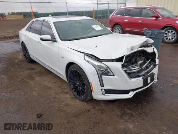 ✅ 2016 Cadillac CT6 Platinum AWD • VIN: 1G6KK5R62GU165223 • Lot: 43601642. Listed on IAAI with 135,869 mi. Free auction sales archive from the USA and detailed vehicle history report at DreamBid. Image 1.