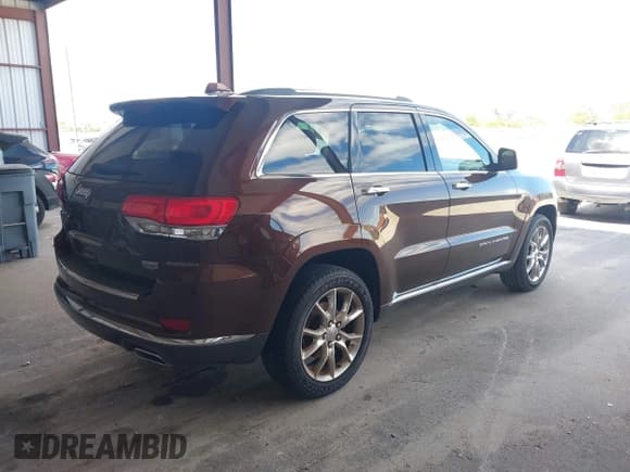 ✅ 2015 Jeep Grand Cherokee Summit • VIN: 1C4RJEJG2FC829205 • Lot: 43469676. Listed on IAAI with 89,893 mi. Free auction sales archive from the USA and detailed vehicle history report at DreamBid. Image 4.