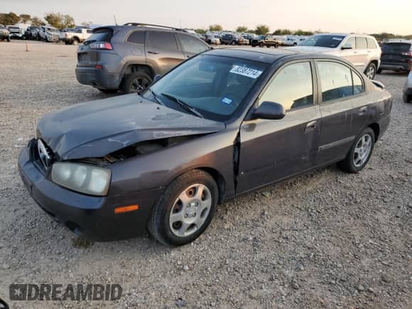 2003 Hyundai Elantra GLS z VIN KMHDN45D53U572664, wystawiony jako Copart lot #82387214 z przebiegiem Nie podano mil oraz Szkoda całkowita • Salvage title. Historia ofert i sprzedaży dostępna na DreamBid. Obrazek 1.