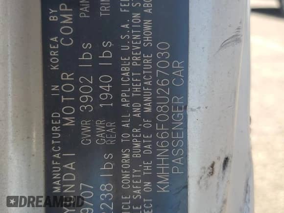 2008 Hyundai Tiburon GT z VIN KMHHN66F08U267030, wystawiony jako Copart lot #67479764 z przebiegiem Nie podano mil oraz Szkoda całkowita • Salvage title. Historia ofert i sprzedaży dostępna na DreamBid. Obrazek 12.