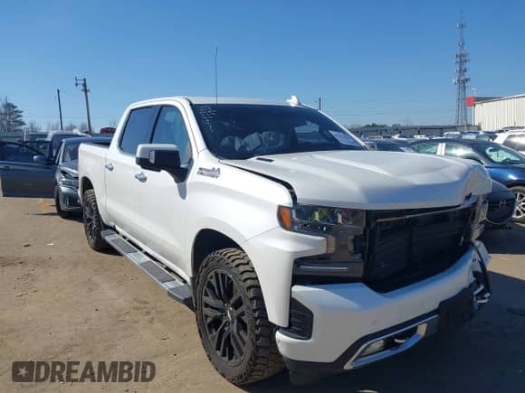 2020 Chevrolet Silverado 1500 High Country with VIN 1GCUYHET5LZ209519, listed as a IAAI auction lot 41771982 with 128,394 mi miles and . Bid and sale history available at DreamBid. Image 1.