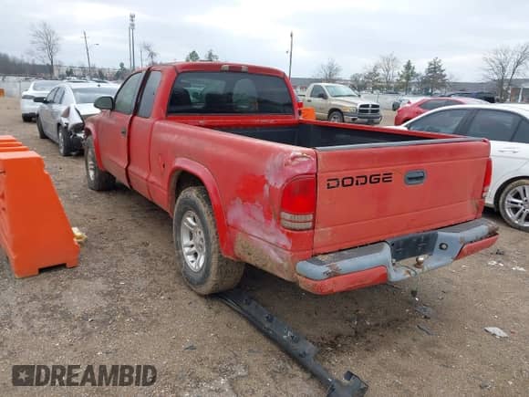 2002 Dodge Dakota Sport z VIN 1B7GL32XX2S558947, wystawiony jako IAAI lot #41538339 z przebiegiem 126 150 mil mil oraz . Historia ofert i sprzedaży dostępna na DreamBid. Obrazek 3.