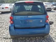 ✅ 2009 Smart fortwo Pure • VIN: WMEEJ31X69K312553 • Лот: 57811135. Опубликован ранее на Copart с пробегом 156 487 миль. Бесплатный доступ к архиву аукционных продаж из США и подробный отчёт об истории автомобиля на DreamBid. Изображение 6.