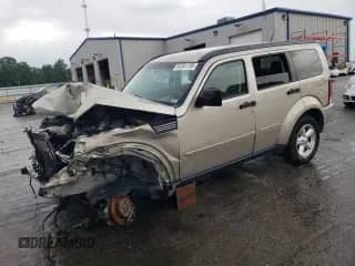 2010 Dodge Nitro SE z VIN 1D4PU2GK4AW126658, wystawiony jako Copart lot #62361795 z przebiegiem 127 699 mil mil oraz Szkoda całkowita • Salvage title. Historia ofert i sprzedaży dostępna na DreamBid. Obrazek 1.