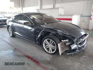 ✅ 2015 Tesla Model S 85 • VIN: 5YJSA1S12FF100404 • Lot: 42769147. Listed on IAAI with 98,700 mi. Free auction sales archive from the USA and detailed vehicle history report at DreamBid. Image 1.