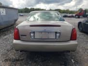 ✅ 2004 Cadillac DeVille DHS • VIN: 1G6KE57Y74U116879 • Lot: 71017214. Wystawiony na Copart z przebiegiem 130 169 mil. Bezpłatny archiwum sprzedaży aukcyjnych z USA i szczegółowy raport historii pojazdu na DreamBid. Zdjęcie 6.