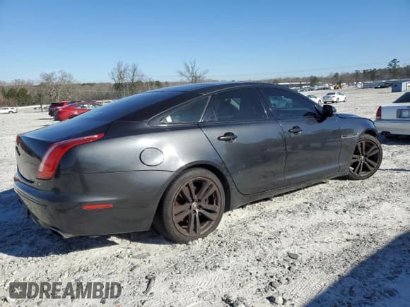 ✅ 2012 Jaguar XJ • VIN: SAJWA1CB1CLV31450 • Лот: 46883875. Опубликован ранее на Copart с пробегом 150 268 миль. Бесплатный доступ к архиву аукционных продаж из США и подробный отчёт об истории автомобиля на DreamBid. Изображение 3.