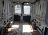 ✅ 2020 Ford Transit Cargo • VIN: 1FTBR1C89LKA80798 • Lot: 42123344. Listed on IAAI with 64,773 mi. Free auction sales archive from the USA and detailed vehicle history report at DreamBid. Image 8.