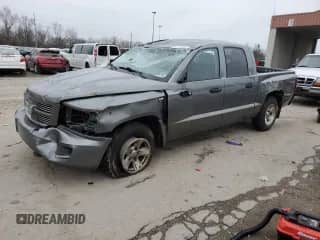 2010 Dodge Dakota SXT с VIN 1D7CW3GP7AS176121, выставлен на аукционе Copart как лот 85169354 с пробегом Не указан миль и Списание • Salvage title. История ставок и продаж доступна на DreamBid. Изображение 1.