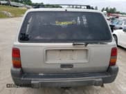 ✅ 1996 Jeep Grand Cherokee Laredo • VIN: 1J4GZ58S2TC401845 • Лот: 61013044. Опубликован ранее на Copart с пробегом Не указан. Бесплатный доступ к архиву аукционных продаж из США и подробный отчёт об истории автомобиля на DreamBid. Изображение 6.