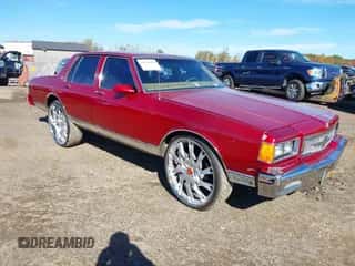 1986 Chevrolet Caprice z VIN 1G1BN69H7G9132578, wystawiony jako IAAI lot #43501999 z przebiegiem 52 123 mil mil oraz . Historia ofert i sprzedaży dostępna na DreamBid. Obrazek 1.