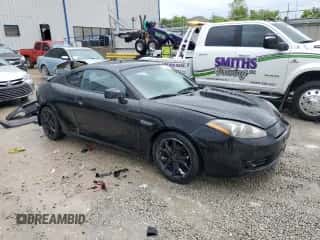 2008 Hyundai Tiburon GT с VIN KMHHN66F08U289898, выставлен на аукционе Copart как лот 56485235 с пробегом 169 568 миль миль и На запчасти • Non repairable. История ставок и продаж доступна на DreamBid. Изображение 4.