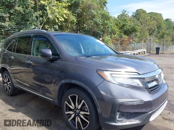 ✅ 2019 Honda Pilot Touring 8-Passenger • VIN: 5FNYF5H95KB010979 • Lot: 43285702. Listed on IAAI with 147,812 mi. Free auction sales archive from the USA and detailed vehicle history report at DreamBid. Image 13.