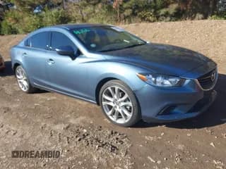 ✅ 2014 Mazda 6 i Touring • VIN: JM1GJ1V64E1159989 • Lot: 43709647. Listed on IAAI with 60,732 mi. Free auction sales archive from the USA and detailed vehicle history report at DreamBid. Image 1.