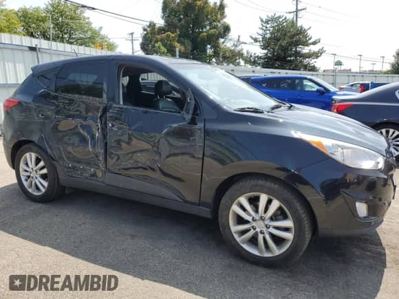 2012 Hyundai Tucson GLS z VIN KM8JU3AC5CU344709, wystawiony jako Copart lot #68502204 z przebiegiem 148 356 mil mil oraz Szkoda całkowita • Salvage title. Historia ofert i sprzedaży dostępna na DreamBid. Obrazek 4.