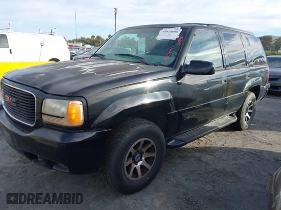 ✅ 2000 GMC Denali • VIN: 1GKEK63RXYR183092 • Lot: 43628890. Listed on IAAI with 185,645 mi. Free auction sales archive from the USA and detailed vehicle history report at DreamBid. Image 2.