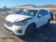 ✅ 2016 Mazda CX-5 Grand Touring • VIN: JM3KE4DY6G0864294 • Lot: 43639964. Wystawiony na IAAI z przebiegiem 119 285 mil. Bezpłatny archiwum sprzedaży aukcyjnych z USA i szczegółowy raport historii pojazdu na DreamBid. Zdjęcie 17.