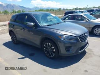 ✅ 2016 Mazda CX-5 Grand Touring • VIN: JM3KE4DY3G0912088 • Lot: 42203530. Wystawiony na IAAI z przebiegiem 86 914 mil. Bezpłatny archiwum sprzedaży aukcyjnych z USA i szczegółowy raport historii pojazdu na DreamBid. Zdjęcie 1.