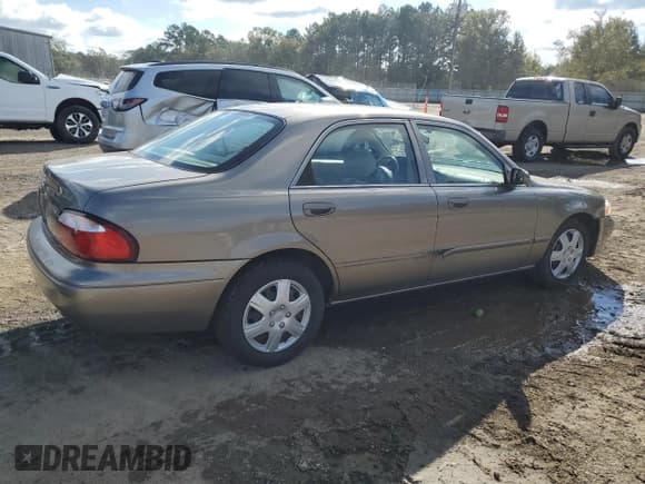 ✅ 2001 Mazda 626 LX • VIN: 1YVGF22CX15216386 • Lot: 90853915. Wystawiony na Copart z przebiegiem 48 162 mil. Bezpłatny archiwum sprzedaży aukcyjnych z USA i szczegółowy raport historii pojazdu na DreamBid. Zdjęcie 3.