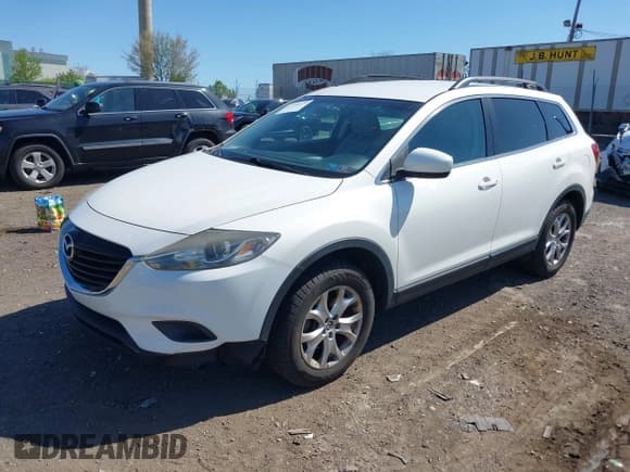 ✅ 2015 Mazda CX-9 Touring • VIN: JM3TB3CV1F0461403 • Lot: 42148325. Listed on IAAI with 143,452 mi. Free auction sales archive from the USA and detailed vehicle history report at DreamBid. Image 2.