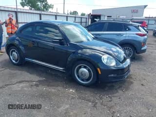 ✅ 2012 Volkswagen Beetle 2.5L • VIN: 3VWJX7AT1CM646664 • Lot: 42531165. Listed on IAAI with 67,189 mi. Free auction sales archive from the USA and detailed vehicle history report at DreamBid. Image 1.