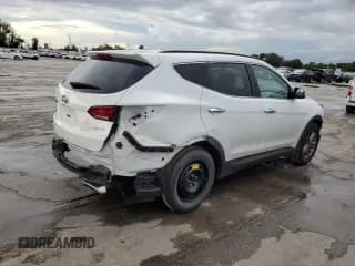 ✅ 2018 Hyundai Santa Fe 2.4L • VIN: 5XYZU3LB9JG531249 • Лот: 64804203. Опубликован ранее на Copart с пробегом 36 522 миль. Бесплатный доступ к архиву аукционных продаж из США и подробный отчёт об истории автомобиля на DreamBid. Изображение 3.