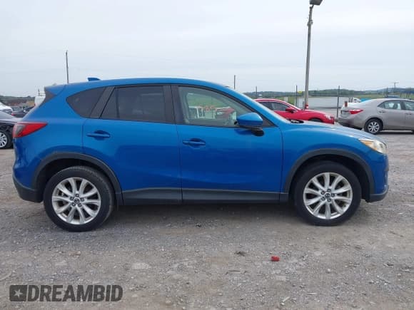 ✅ 2013 Mazda CX-5 Grand Touring • VIN: JM3KE2DE0D0100155 • Lot: 43341585. Listed on IAAI with 297,809 mi. Free auction sales archive from the USA and detailed vehicle history report at DreamBid. Image 13.