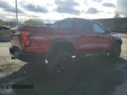 ✅ 2024 Chevrolet Colorado 4WD Trail Boss • VIN: 1GCPTEEKXR1199756 • Лот: 86307465. Опубликован ранее на Copart с пробегом 30 407 миль. Бесплатный доступ к архиву аукционных продаж из США и подробный отчёт об истории автомобиля на DreamBid. Изображение 3.