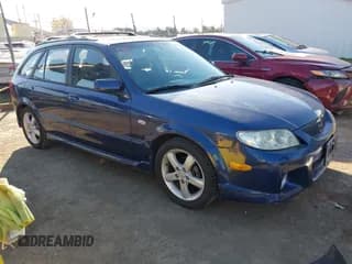 ✅ 2003 Mazda Protege • VIN: JM1BJ246831151148 • Lot: 41472821. Wystawiony na IAAI z przebiegiem 247 589 mil. Bezpłatny archiwum sprzedaży aukcyjnych z USA i szczegółowy raport historii pojazdu na DreamBid. Zdjęcie 1.