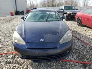 2008 Hyundai Tiburon GT z VIN KMHHN66F08U288041, wystawiony jako Copart lot #48870495 z przebiegiem 212 039 mil mil oraz Czysty tytuł • Clean title. Historia ofert i sprzedaży dostępna na DreamBid. Obrazek 5.