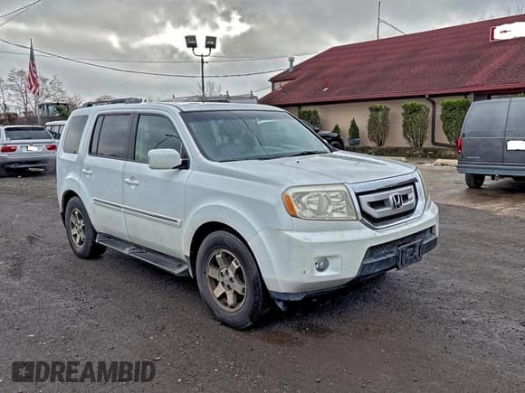 ✅ 2009 Honda Pilot Touring • VIN: 5FNYF48969B023986 • Lot: 94935315. Listed on Copart with 213,080 mi. Free auction sales archive from the USA and detailed vehicle history report at DreamBid. Image 1.