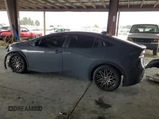 ✅ 2023 Toyota Prius XLE • VIN: JTDACAAU6P3001827 • Лот: 84443405. Опубликован ранее на Copart с пробегом 97 379 миль. Бесплатный доступ к архиву аукционных продаж из США и подробный отчёт об истории автомобиля на DreamBid. Изображение 2.