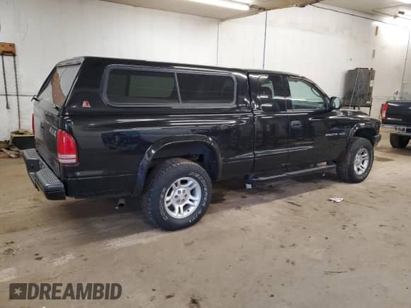 2002 Dodge Dakota Sport z VIN 1B7GG32N92S563589, wystawiony jako Copart lot #79580194 z przebiegiem 110 736 mil mil oraz Czysty tytuł • Clean title. Historia ofert i sprzedaży dostępna na DreamBid. Obrazek 3.