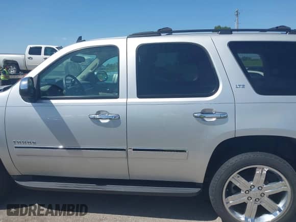 2011 Chevrolet Tahoe LTZ with VIN 1GNSKCE03BR368837, listed as a IAAI auction lot 42741642 with 166,196 mi miles and . Bid and sale history available at DreamBid. Image 14.