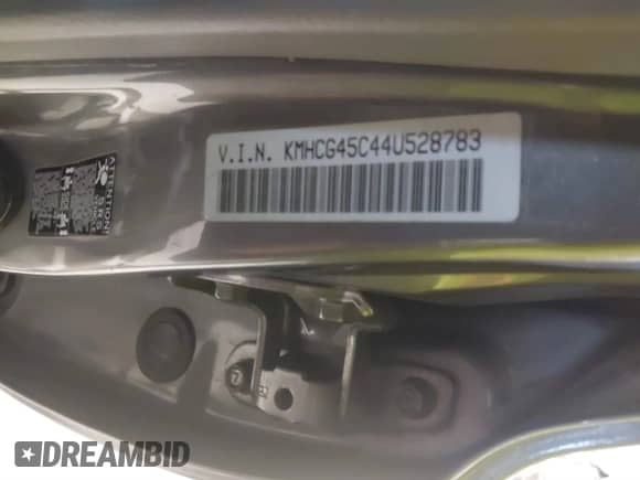 2004 Hyundai Accent GL z VIN KMHCG45C44U528783, wystawiony jako IAAI lot #41535104 z przebiegiem Nie podano mil oraz . Historia ofert i sprzedaży dostępna na DreamBid. Obrazek 9.