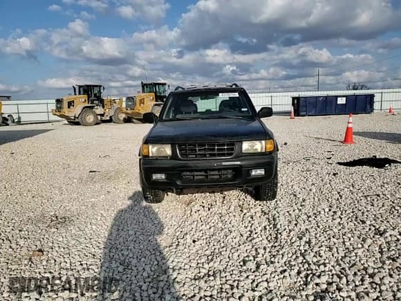 ✅ 1999 Isuzu Rodeo S • VIN: 4S2CK58W3X4362974 • Lot: 43155155. Listed on Copart with 396,448 mi. Free auction sales archive from the USA and detailed vehicle history report at DreamBid. Image 11.