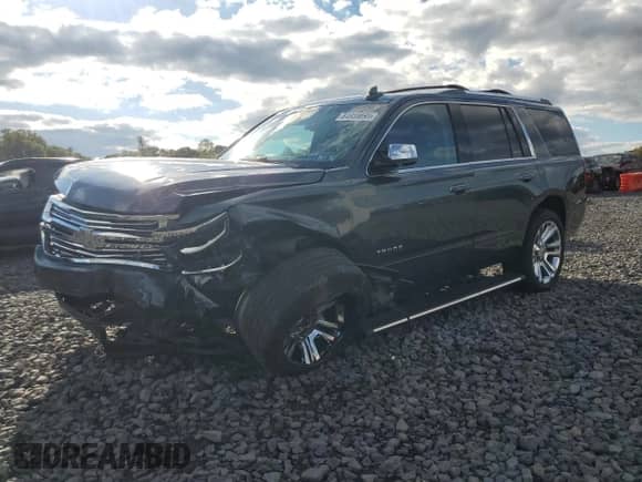 2020 Chevrolet Tahoe Premier with VIN 1GNSKCKJ0LR101198, listed as a Copart auction lot 84955895 with 99,414 mi miles and Salvage title. Bid and sale history available at DreamBid. Image 1.