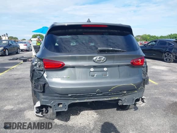 ✅ 2019 Hyundai Santa Fe SE • VIN: 5NMS23AD1KH044131 • Lot: 43237640. Wystawiony na IAAI z przebiegiem 105 619 mil. Bezpłatny archiwum sprzedaży aukcyjnych z USA i szczegółowy raport historii pojazdu na DreamBid. Zdjęcie 6.