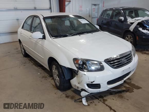 ✅ 2009 Kia Spectra EX • VIN: KNAFE221795662135 • Lot: 43847748. Listed on IAAI with 99,869 mi. Free auction sales archive from the USA and detailed vehicle history report at DreamBid. Image 1.