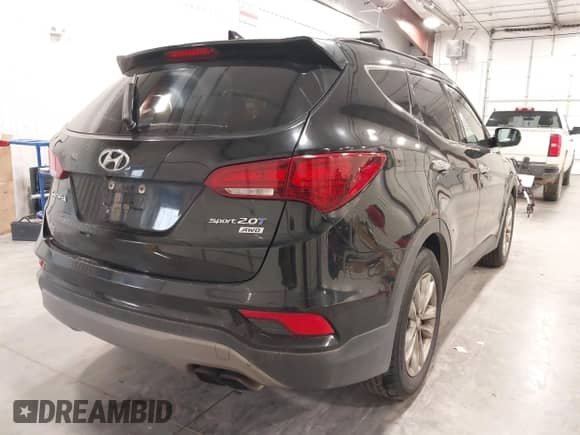 2017 Hyundai Santa Fe 2.0T z VIN 5XYZUDLA9HG433491, wystawiony jako IAAI lot #43298379 z przebiegiem 135 099 mil mil oraz . Historia ofert i sprzedaży dostępna na DreamBid. Obrazek 4.