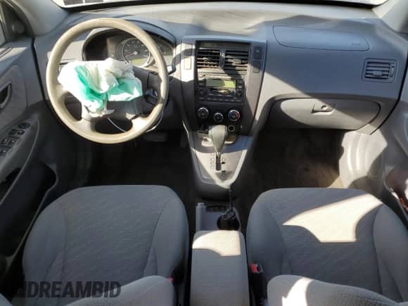 2005 Hyundai Tucson GL z VIN KM8JM12B95U067091, wystawiony jako Copart lot #79297524 z przebiegiem Nie podano mil oraz Szkoda całkowita • Salvage title. Historia ofert i sprzedaży dostępna na DreamBid. Obrazek 8.