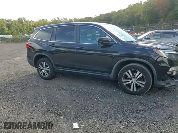 ✅ 2017 Honda Pilot EX-L • VIN: 5FNYF6H57HB045857 • Lot: 85780035. Listed on Copart with 97,247 mi. Free auction sales archive from the USA and detailed vehicle history report at DreamBid. Image 14.