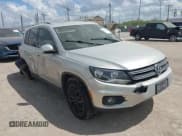 ✅ 2012 Volkswagen Tiguan S • VIN: WVGBV7AX6CW585386 • Lot: 43267607. Listed on IAAI with 91,618 mi. Free auction sales archive from the USA and detailed vehicle history report at DreamBid. Image 1.
