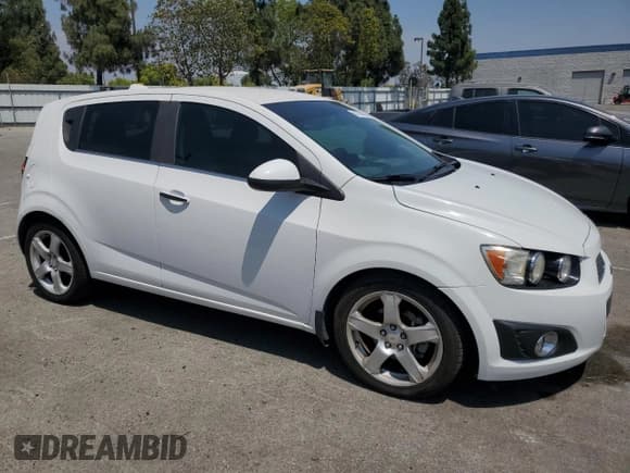 ✅ 2012 Chevrolet Sonic LTZ • VIN: 1G1JE6SH2C4151651 • Lot: 64218695. Listed on Copart with 102,899 mi. Free auction sales archive from the USA and detailed vehicle history report at DreamBid. Image 4.