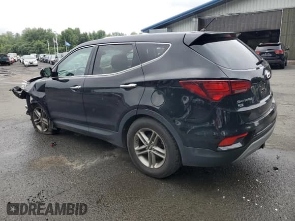 ✅ 2018 Hyundai Santa Fe 2.4L • VIN: 5XYZTDLB9JG569962 • Лот: 66455414. Опубликован ранее на Copart с пробегом 100 231 миль. Бесплатный доступ к архиву аукционных продаж из США и подробный отчёт об истории автомобиля на DreamBid. Изображение 2.