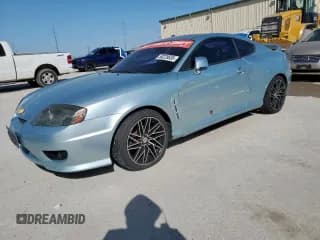 ✅ 2006 Hyundai Tiburon GT • VIN: KMHHN65F96U208668 • Лот: 50229835. Опубликован ранее на Copart с пробегом 123 075 миль. Бесплатный доступ к архиву аукционных продаж из США и подробный отчёт об истории автомобиля на DreamBid. Изображение 1.